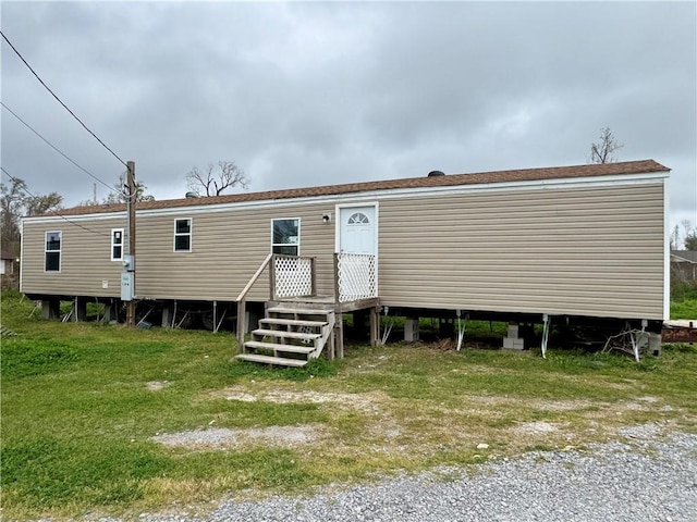 back of house with a yard