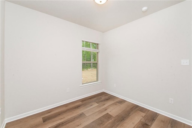 20069 Narretto Rd, Loranger, LA 70446 - spare room with baseboards and wood finished floors