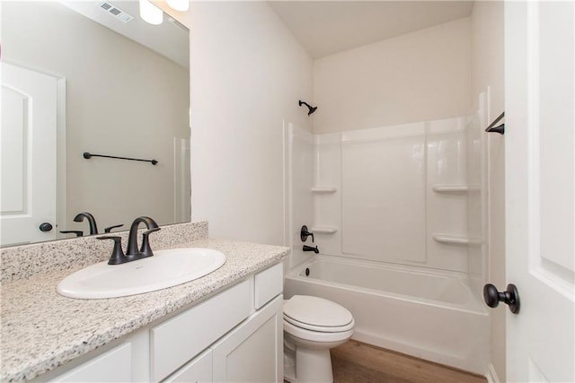 20069 Narretto Rd, Loranger, LA 70446 - bathroom with visible vents, wood finished floors, vanity, toilet, and shower / bathtub combination
