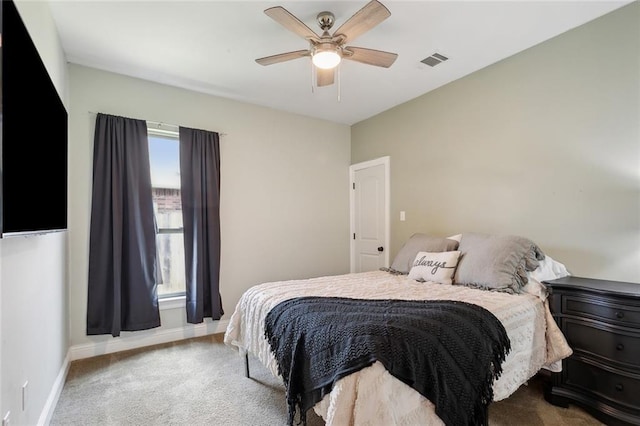 bedroom with a ceiling fan, baseboards, visible vents, and carpet floors