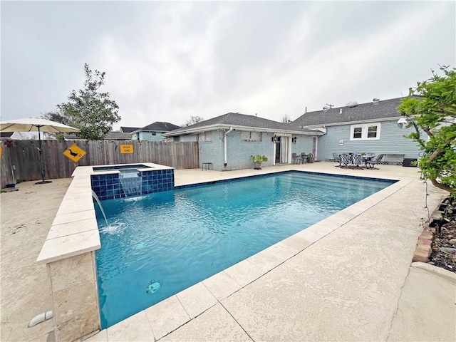 view of pool featuring a fenced in pool, an in ground hot tub, a fenced backyard, and a patio area