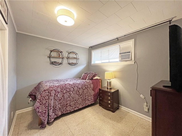 bedroom with baseboards and ornamental molding