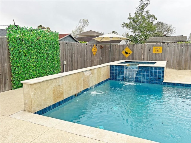 view of swimming pool with a fenced in pool, a hot tub, and a fenced backyard