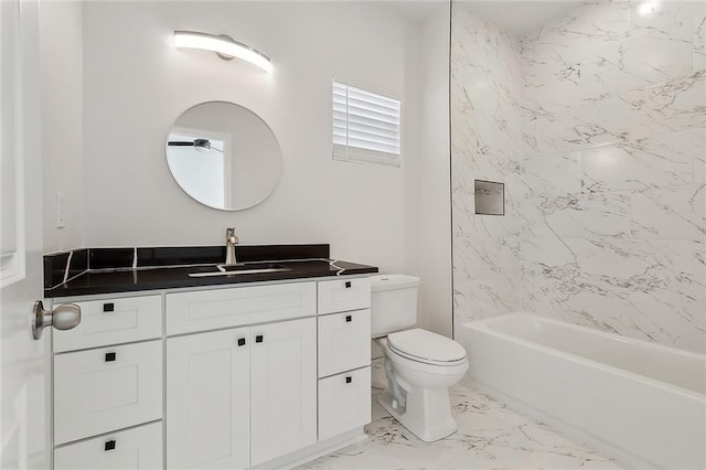 bathroom with toilet, marble finish floor, a ceiling fan, shower / washtub combination, and vanity