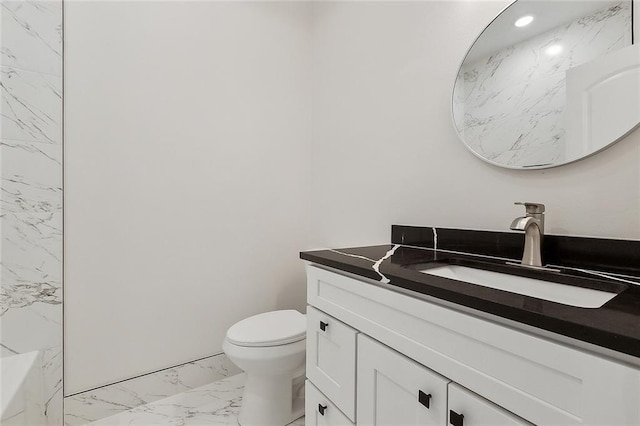 bathroom featuring recessed lighting, toilet, marble finish floor, and vanity