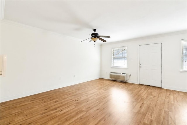 3000 July St Unit 2115, Baton Rouge, LA 70808 - unfurnished room featuring ornamental molding, light wood-style floors, and a wall mounted AC