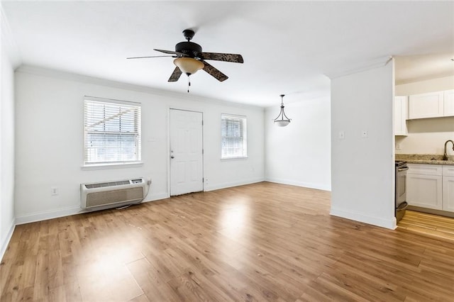 3000 July St Unit 2115, Baton Rouge, LA 70808 - unfurnished living room with light wood-style floors, a healthy amount of sunlight, ornamental molding, and a wall mounted AC