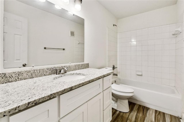 3000 July St Unit 2115, Baton Rouge, LA 70808 - full bath with vanity, wood finished floors, visible vents, shower / washtub combination, and toilet