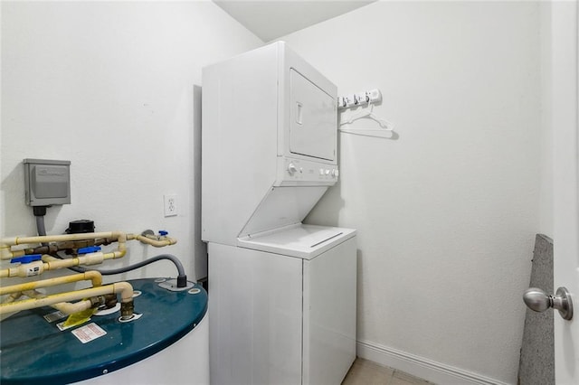 3000 July St Unit 2115, Baton Rouge, LA 70808 - laundry room featuring baseboards, water heater, laundry area, and stacked washing maching and dryer