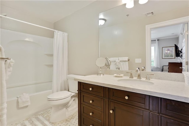 full bathroom with visible vents, toilet, vanity, and shower / tub combo