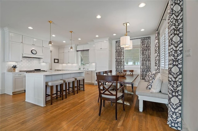 dining space featuring recessed lighting and light wood finished floors