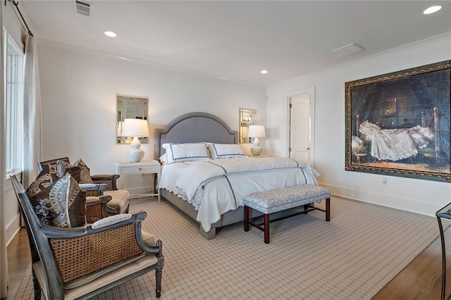 bedroom featuring recessed lighting, visible vents, baseboards, and wood finished floors