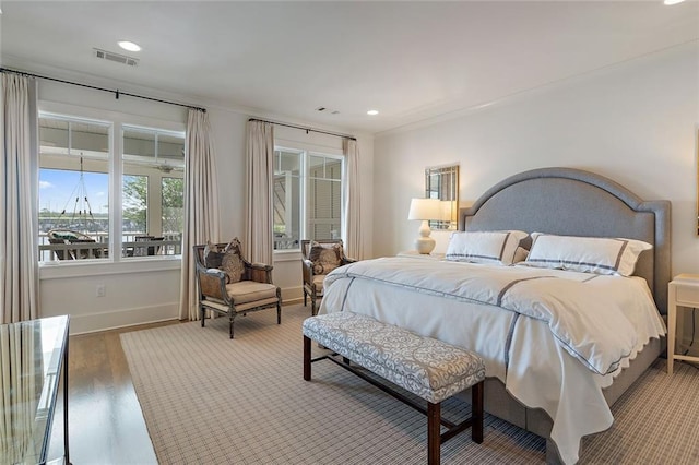 bedroom featuring visible vents, recessed lighting, baseboards, and wood finished floors