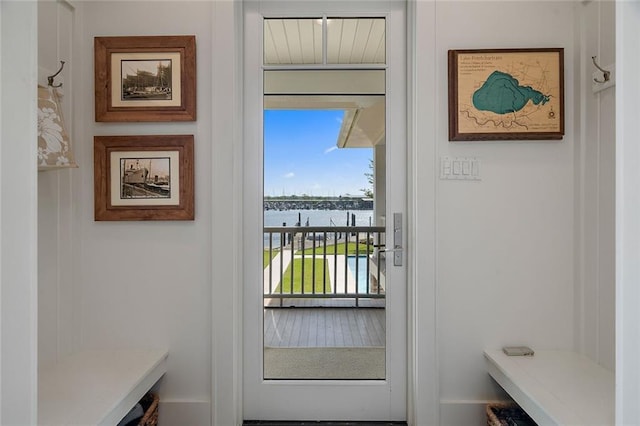 doorway to outside featuring a water view