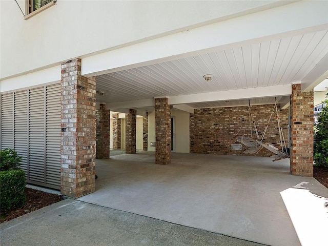 view of patio with a carport and concrete driveway