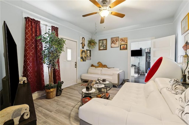 living room featuring wood finished floors and a ceiling fan