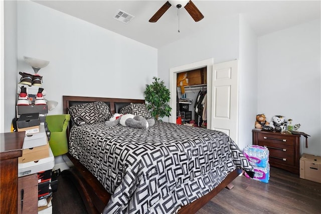 bedroom with a closet, visible vents, ceiling fan, and wood finished floors