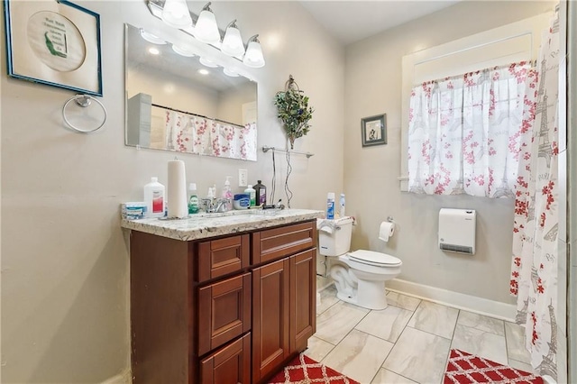 full bath featuring baseboards, toilet, and vanity