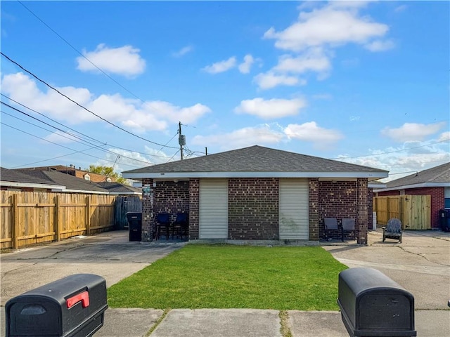 504 Dubarry Pl, Chalmette, LA 70043 - view of front of house featuring brick siding, a shingled roof, and a patio