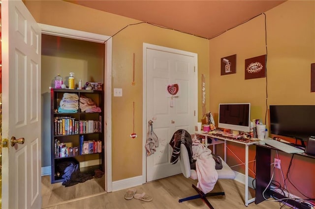 office with wood finished floors and baseboards