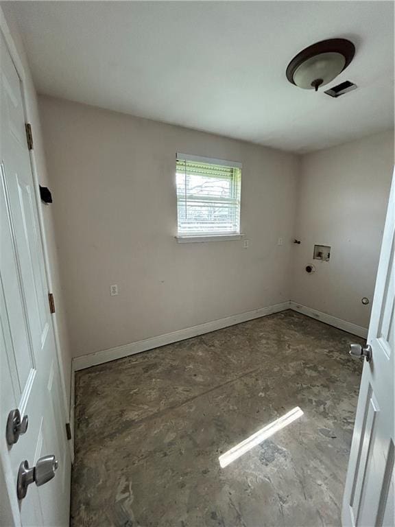 unfurnished room with visible vents and baseboards