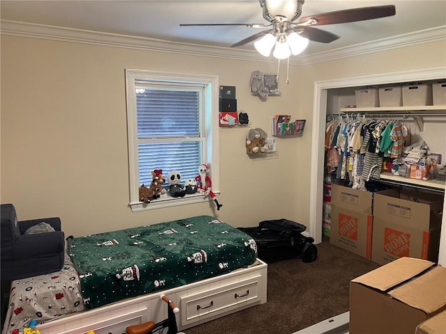 carpeted bedroom with a closet, crown molding, and ceiling fan