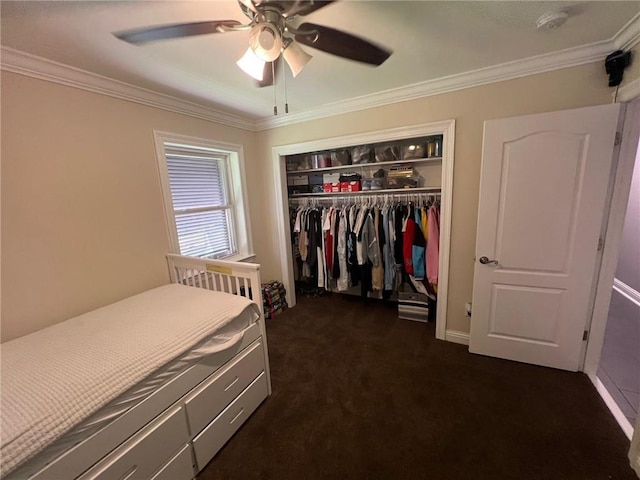 bedroom with a ceiling fan, a closet, dark carpet, and ornamental molding