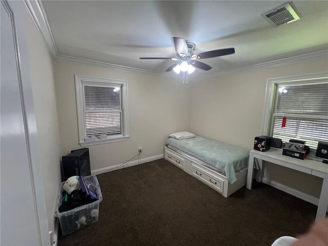 bedroom featuring visible vents, ornamental molding, dark carpet, baseboards, and ceiling fan