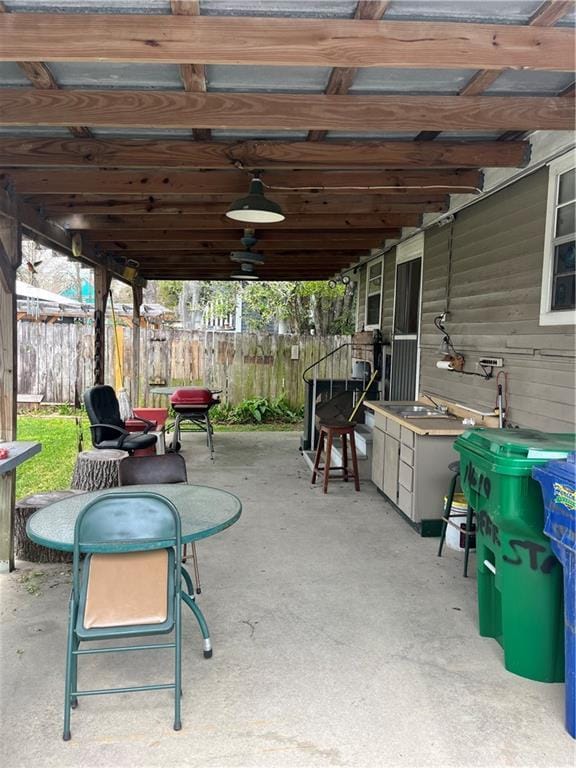 view of patio / terrace featuring fence