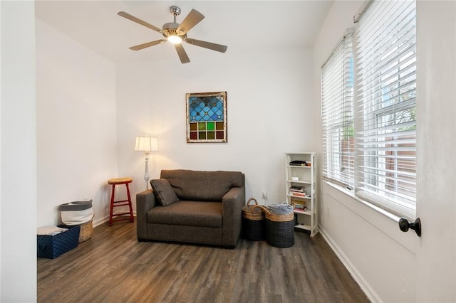 sitting room featuring ceiling fan, baseboards, and wood finished floors