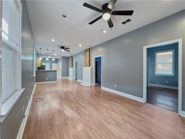 1824 Allen St, New Orleans, LA 70116 - unfurnished living room with ceiling fan, light wood-type flooring, and recessed lighting