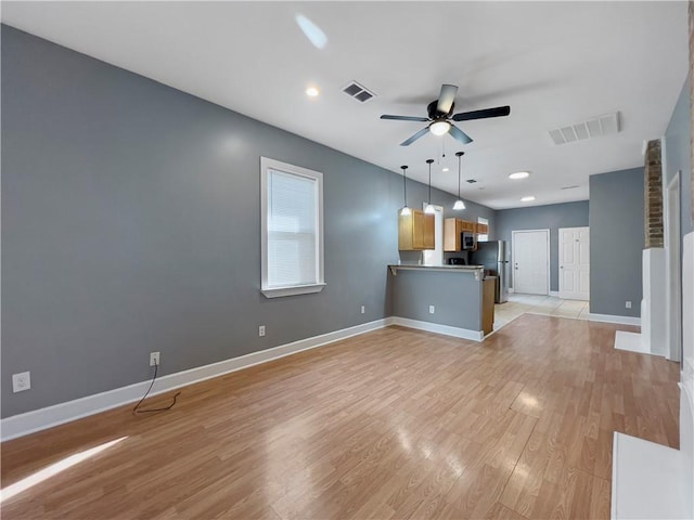 1824 Allen St, New Orleans, LA 70116 - unfurnished living room with ceiling fan and light wood-type flooring