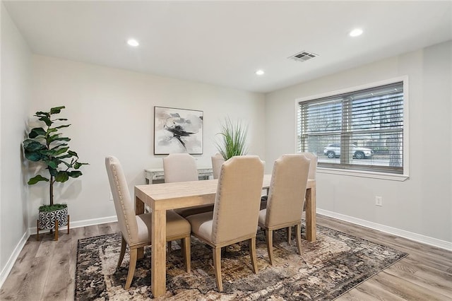 dining room with recessed lighting, wood finished floors, visible vents, and baseboards