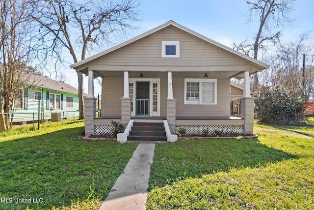 view of front facade with a porch and a front lawn