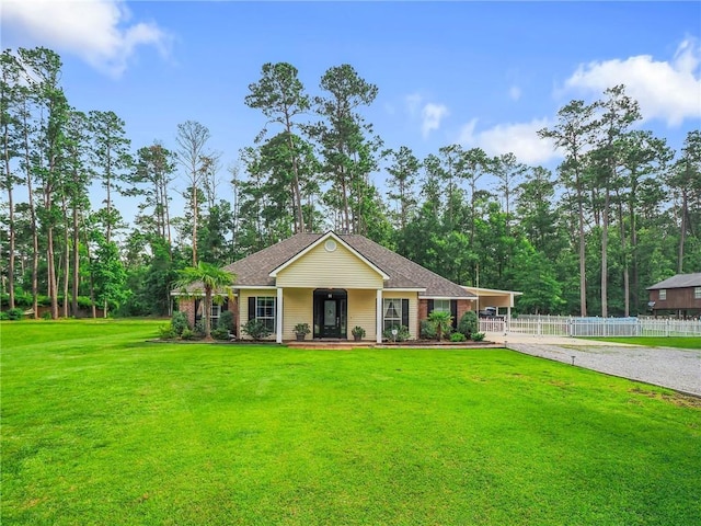 31501 River Pines Dr, Springfield, LA 70462 - view of front of house with fence, a shingled roof, a porch, a front yard, and gravel driveway