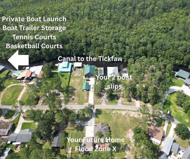 31501 River Pines Dr, Springfield, LA 70462 - bird's eye view featuring a wooded view