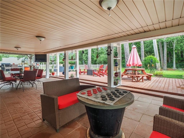 31501 River Pines Dr, Springfield, LA 70462 - view of patio / terrace with a deck, fence, and outdoor dining space