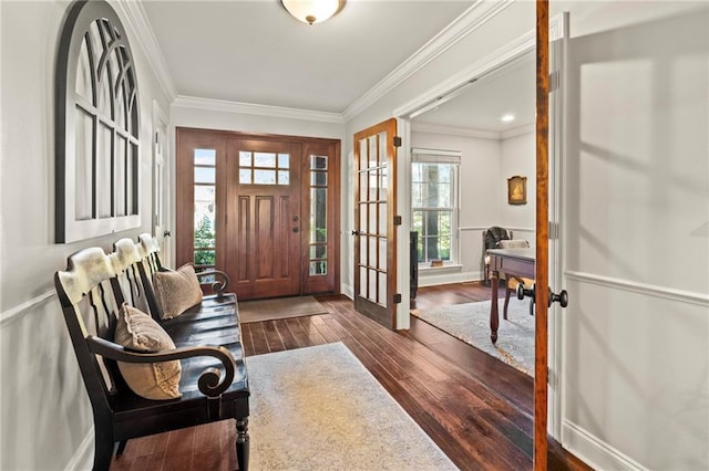 entrance foyer featuring baseboards, dark wood-type flooring, and ornamental molding