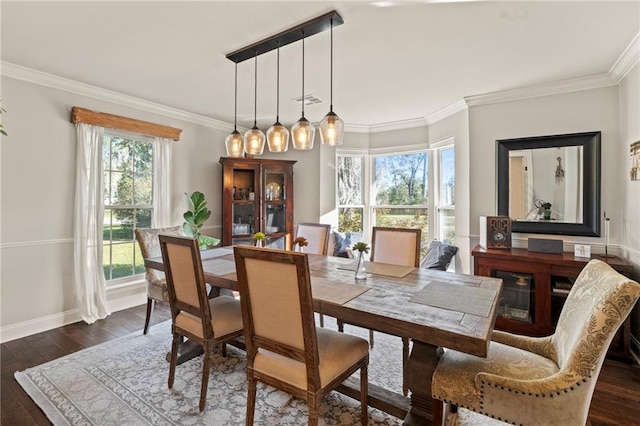 dining room featuring visible vents, baseboards, ornamental molding, and dark wood-style flooring