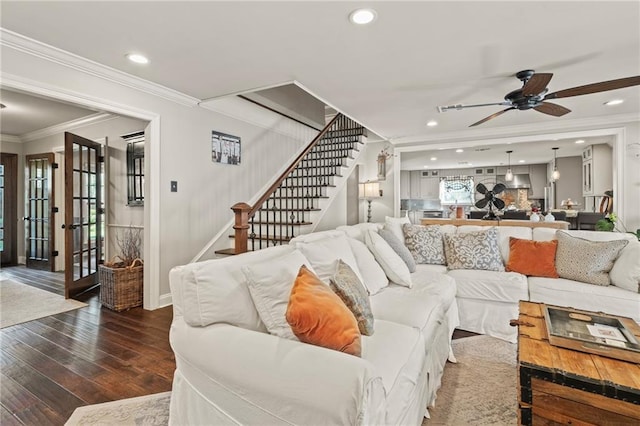 living area with wood finished floors, recessed lighting, stairway, crown molding, and ceiling fan