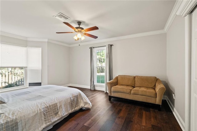 bedroom featuring visible vents, baseboards, crown molding, and hardwood / wood-style flooring