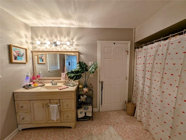 bathroom with a shower with shower curtain, vanity, and a chandelier