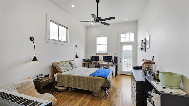 bedroom with access to outside, recessed lighting, light wood-style floors, and ceiling fan