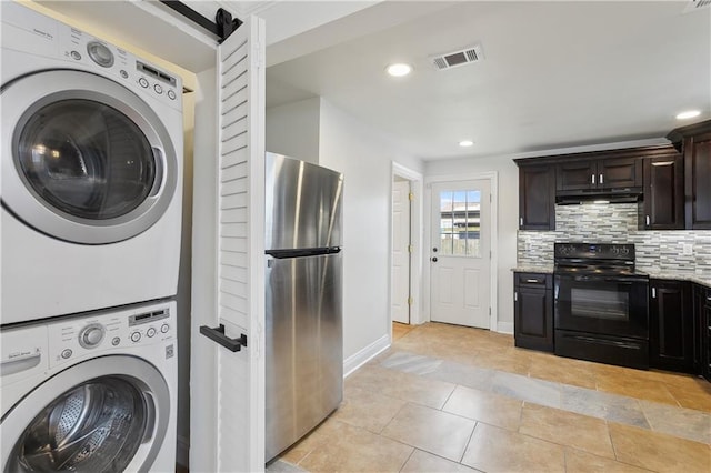 clothes washing area with visible vents, laundry area, light tile patterned flooring, recessed lighting, and stacked washer / drying machine