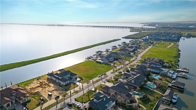 bird's eye view featuring a residential view and a water view