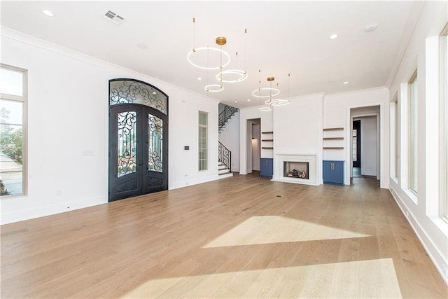 foyer entrance with visible vents, recessed lighting, french doors, crown molding, and light wood finished floors