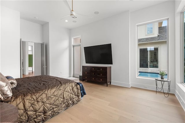 bedroom with a ceiling fan, recessed lighting, wood finished floors, and baseboards