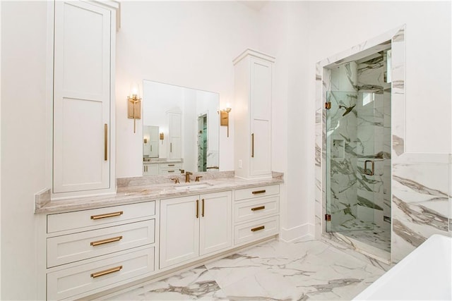 full bath featuring a marble finish shower, marble finish floor, and vanity