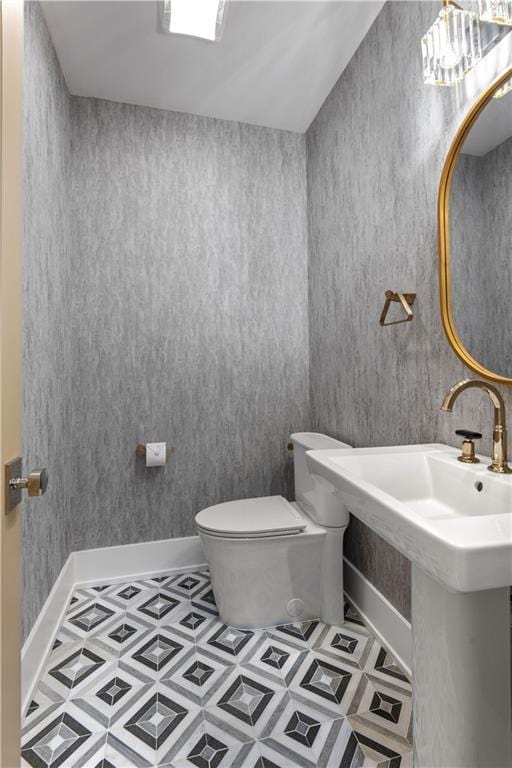 bathroom featuring tile patterned floors and toilet