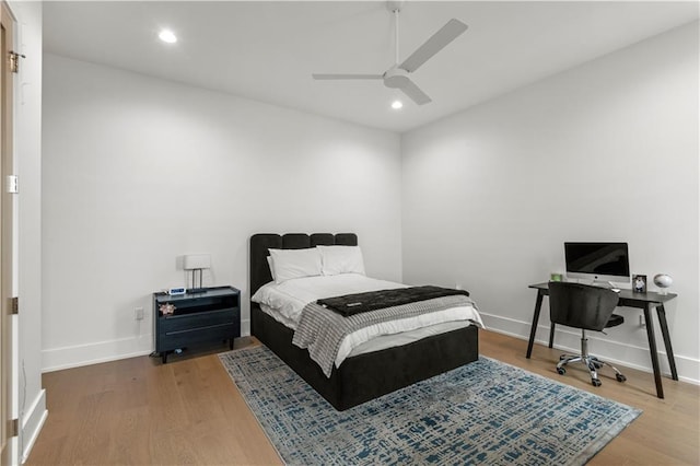 bedroom with recessed lighting, baseboards, wood finished floors, and a ceiling fan